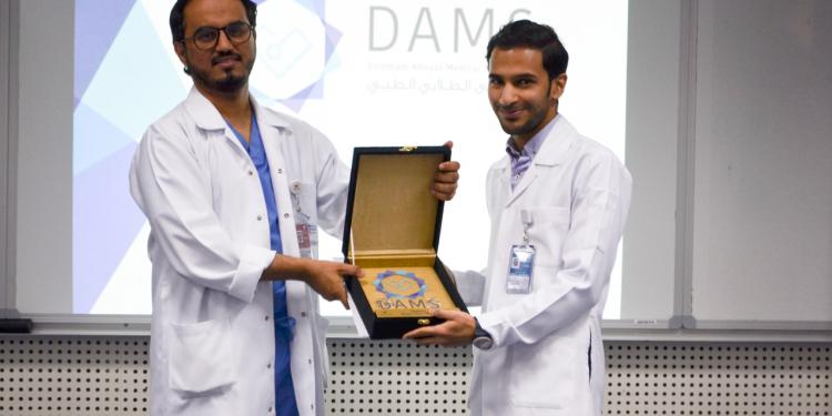 The Director of KFHU honors DAMS Volunteers